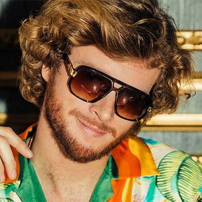 close up picture of yung gravy wearing sunglasses